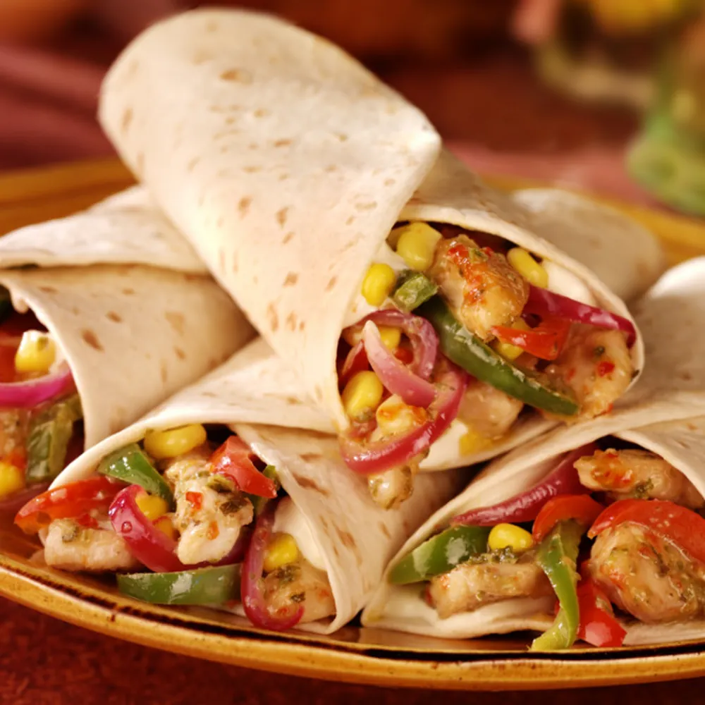 La Favela - fajitas servies dans un plat chaud avec poivrons
